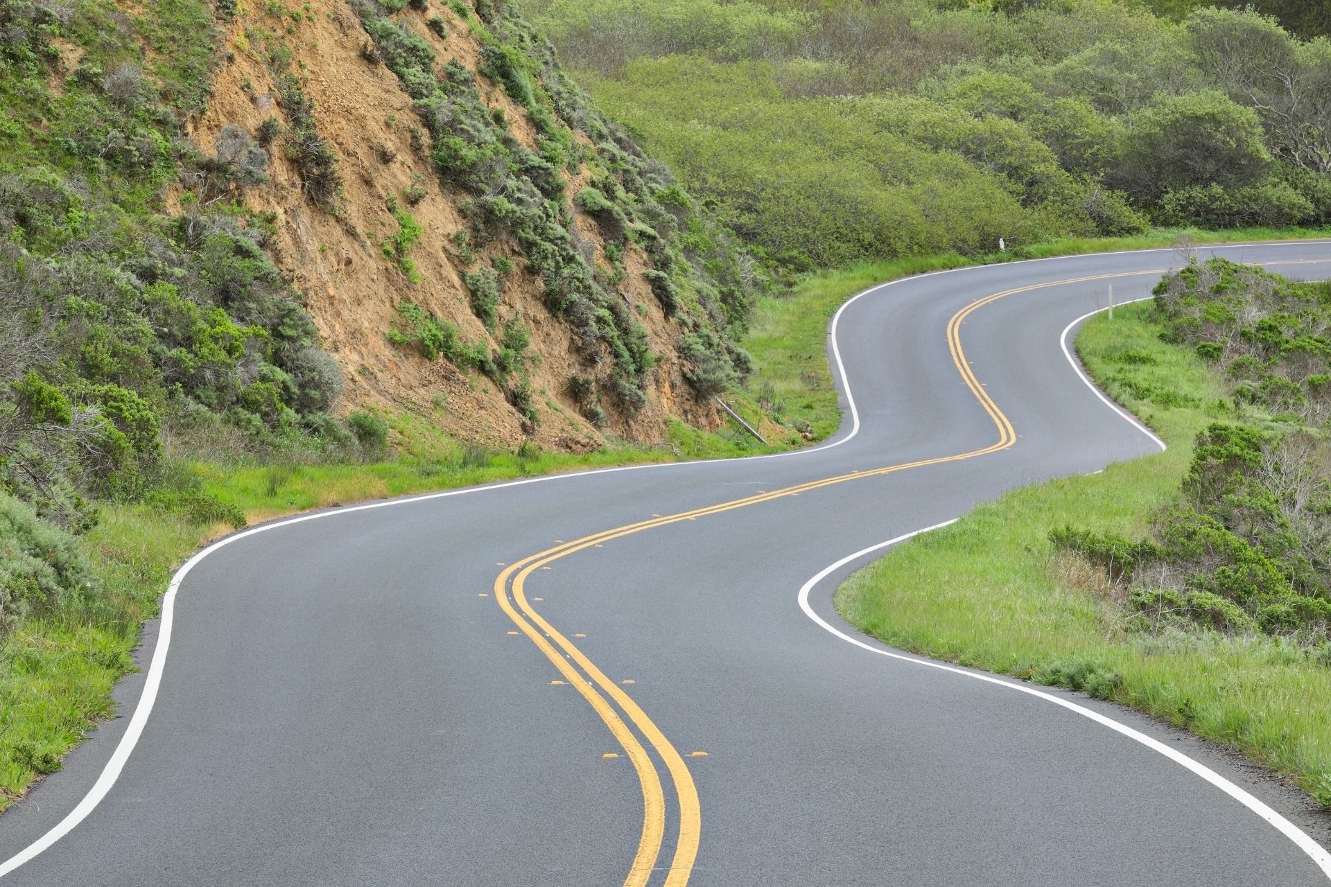 A winding road representing infrastructure development
